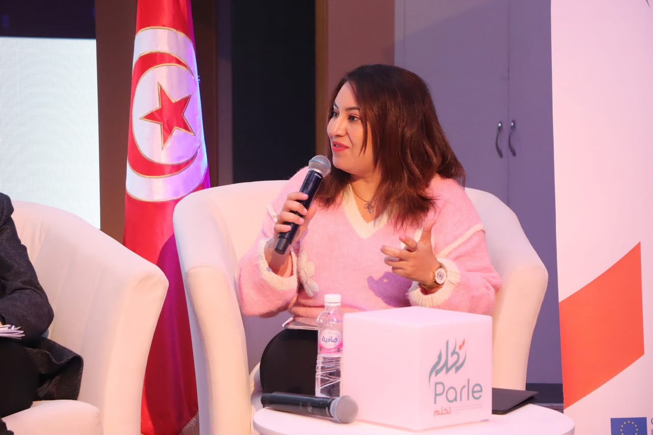 Maha Jouini speaking at a Tunisian event